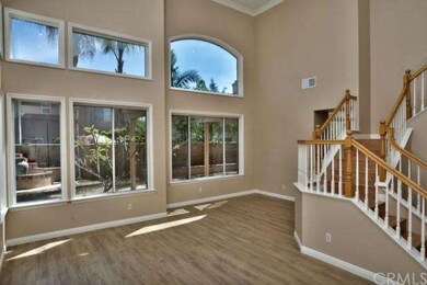 Double doors lead to an inviting entry. Elegantly 