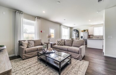 Island kitchen overlooks dining and living areas *