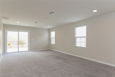 Empty room featuring carpet floors, baseboards, an