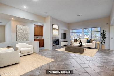 Living room with recessed lighting, visible vents,