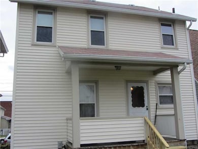 Exterior Back. Rear exterior porch with railing-gr