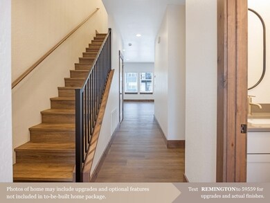 Stairway featuring wood finished floors and recessed lighting