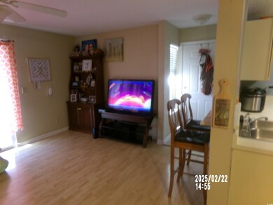 Living room featuring light wood-style floors, cei