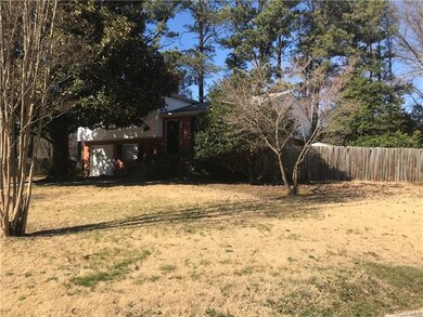 Fenced in back with deck and pond