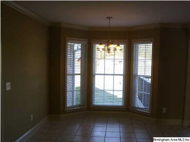 Nice breakfast area with bay window. Kitchen and b