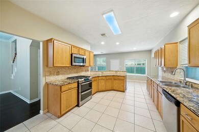 Bright and spacious kitchen with granite counterto