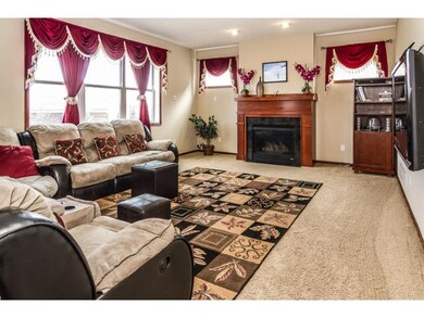 Main floor living room with gas fireplace and buil