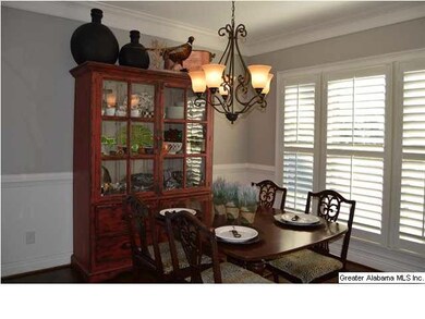The wall of windows in the dining room features 3 