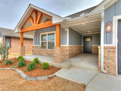 Doorway to property with covered porch, board and 