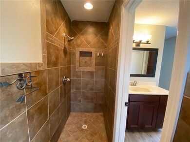  Bathroom view with the shower and vanity