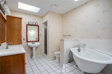 Master bath with claw foot tub, dual vanities and 