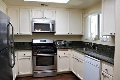Granite counters and backsplash, stainless steel a