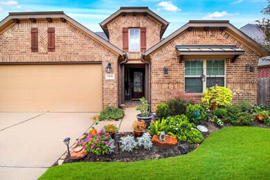 Upgraded exterior elevation of brick all around and upgraded white mortar. Professionally landscaped front, back and side yards. Notice the flowers are in bloom!