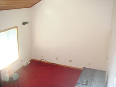 Living Room. Looking down from the steps, shows th