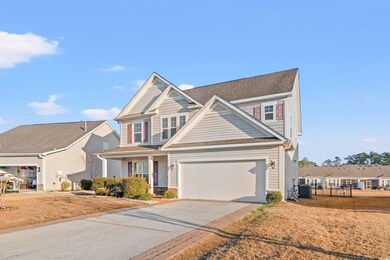 View of front of property with a garage and a fron