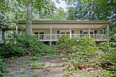 Front of home with rocking chair front porch