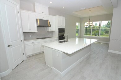 This beautiful kitchen opens right up to the family room so the chef won't miss out on a thing!