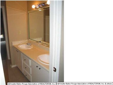 Full bath upstairs connects two bedrooms