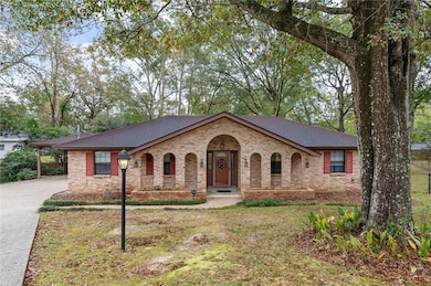 Ranch-style home with a front yard