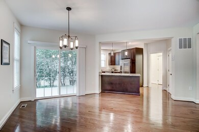 Walkout to covered porch!  Granite counter bar wit