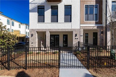 Your own walkway through a fenced front yard leads to your terrace level entry.