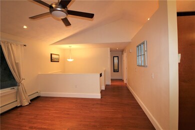 LIVING SPACE AND HALLWAY TO BATHROOM AND TWO BEDRO