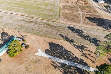 Birds eye view of property with a rural view