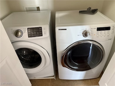 Laundry area featuring washing machine and dryer a