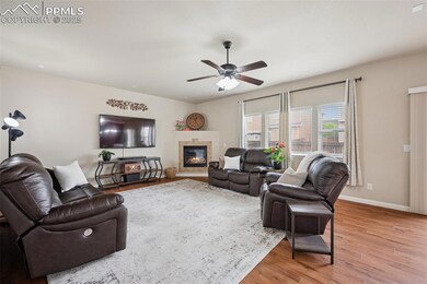 Living room featuring light wood-style floors, a g