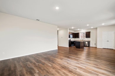 Unfurnished living room with recessed lighting an
