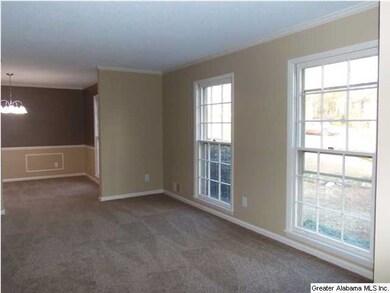 Large windows give the formal living and dining ro