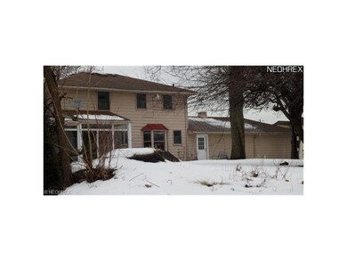 View of the backside of the house showing the encl