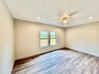 Spare room featuring recessed lighting, wood finished floors, and a ceiling fan