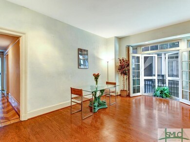 This is the spacious living area with balcony acce