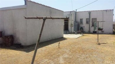 Spacious rear yard offers plenty of room to develo