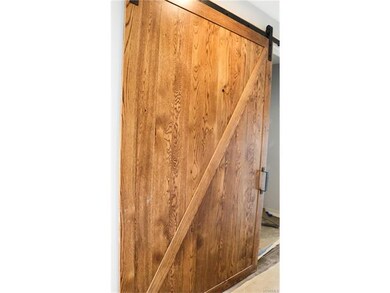 Barn door on entrance to Laundry Room.
