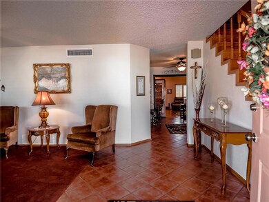 Enter your home through the tiled foyer