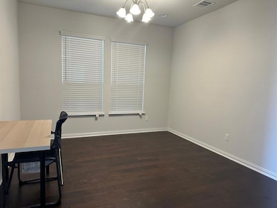 Unfurnished office featuring dark wood-type floor