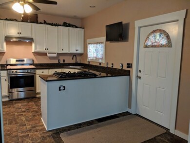 Kitchen with Extra Cook Top and Quartz Counters