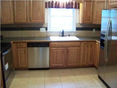 View of the kitchen and cooks like the window that