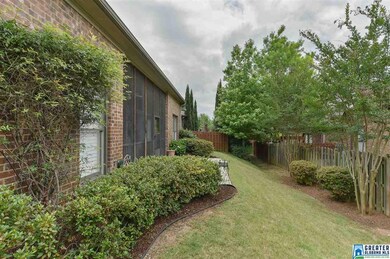 There is low maintenance rear yard with mature lan