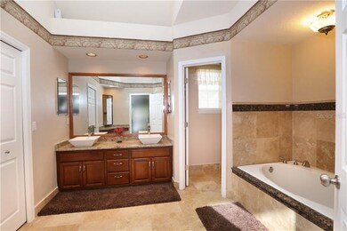 Master bathroom with double sinks and soaking tb