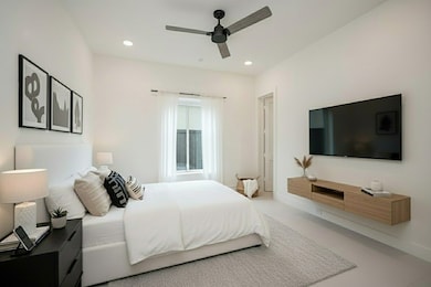1st Floor Bedroom with Large Window, and Walk in Closet with Custom Cabinets. 10' Ceilings. Virtually Staged.