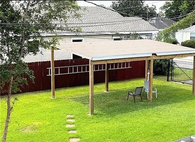 Fantastic side yard with covered entertainment area