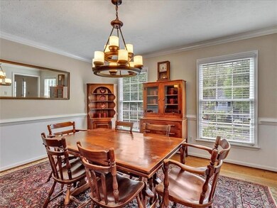 Dining room, hardwoods, crown molding, chair rail