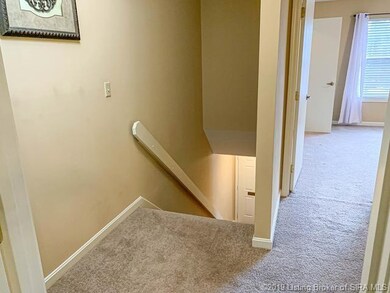 View from upstairs hall with bedroom on right.