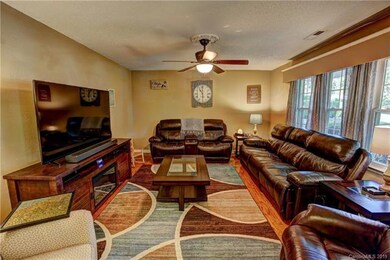 Living room with hardwood floors and plenty of nat
