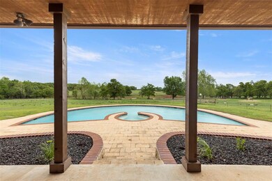 Outdoor pool with a patio and a yard