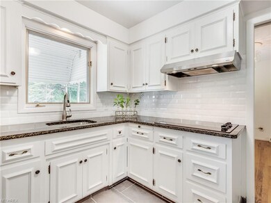 The kitchen features refinished cabinets, brand-ne
