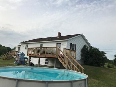 Back of home with deck & pool